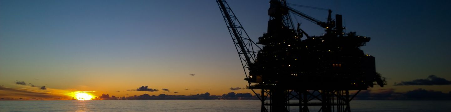 Getty Images 625144818 Oil rig in sunset