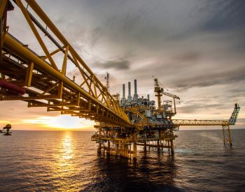 Getty Images 179565748 Oil and gas platform during sunrise or sunset